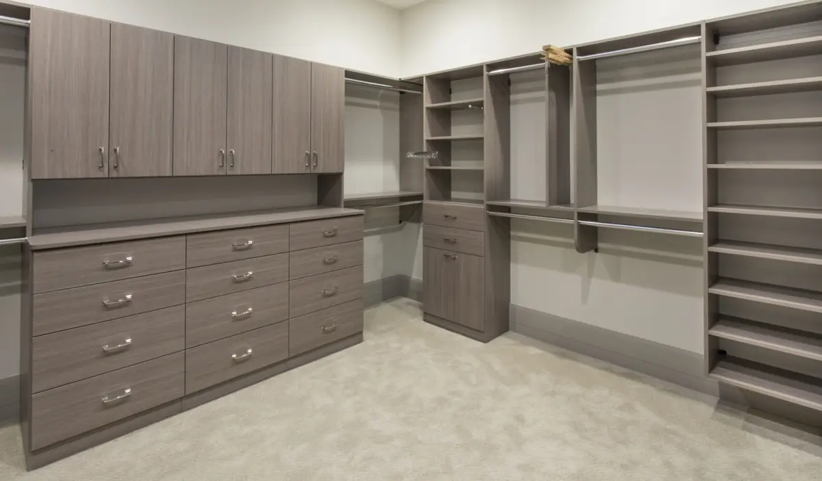 Walk-in closet with gray custom cabinetry and open shelving in West Samoset, FL