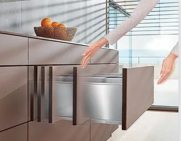 Tip-On Blumotion cabinet door and drawer opening system