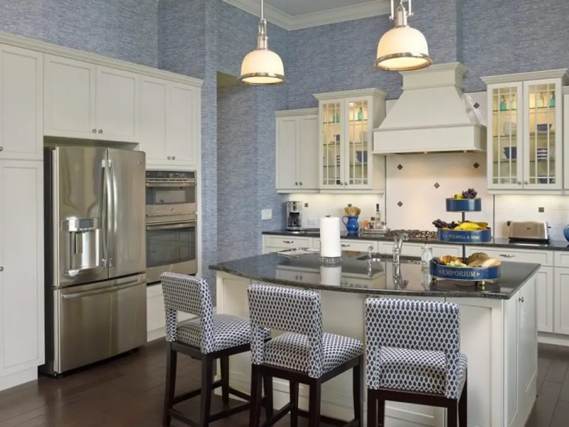 Chef&rsquo;s kitchen with white cabinets and 9-lite offset mullion glass doors