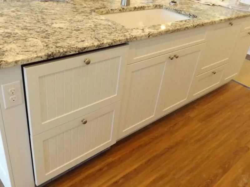 White beadboard kitchen island cabinets during installation