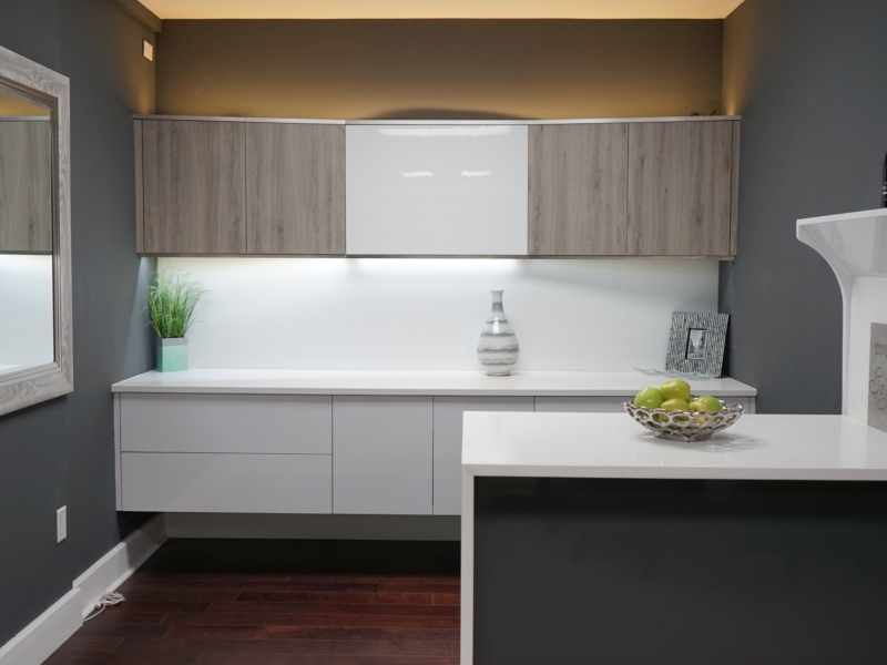 Contemporary wet bar with wood-grain and white gloss cabinets