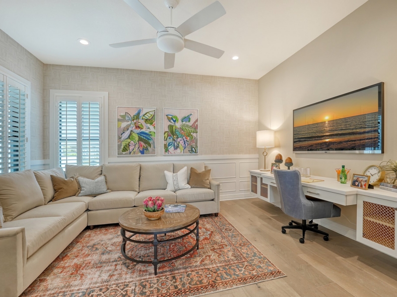 Living room with a white built-in desk and media console