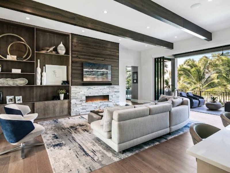 Living room with custom built-in shelving and a media wall