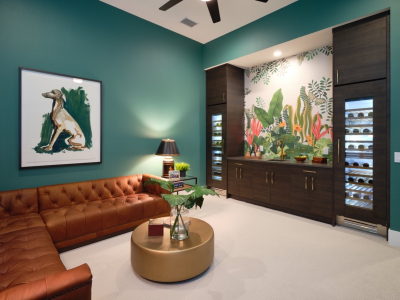 Lounge with dark wood bar cabinetry and built-in wine refrigerators