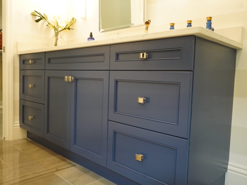 Navy shaker bathroom vanity with brass hardware