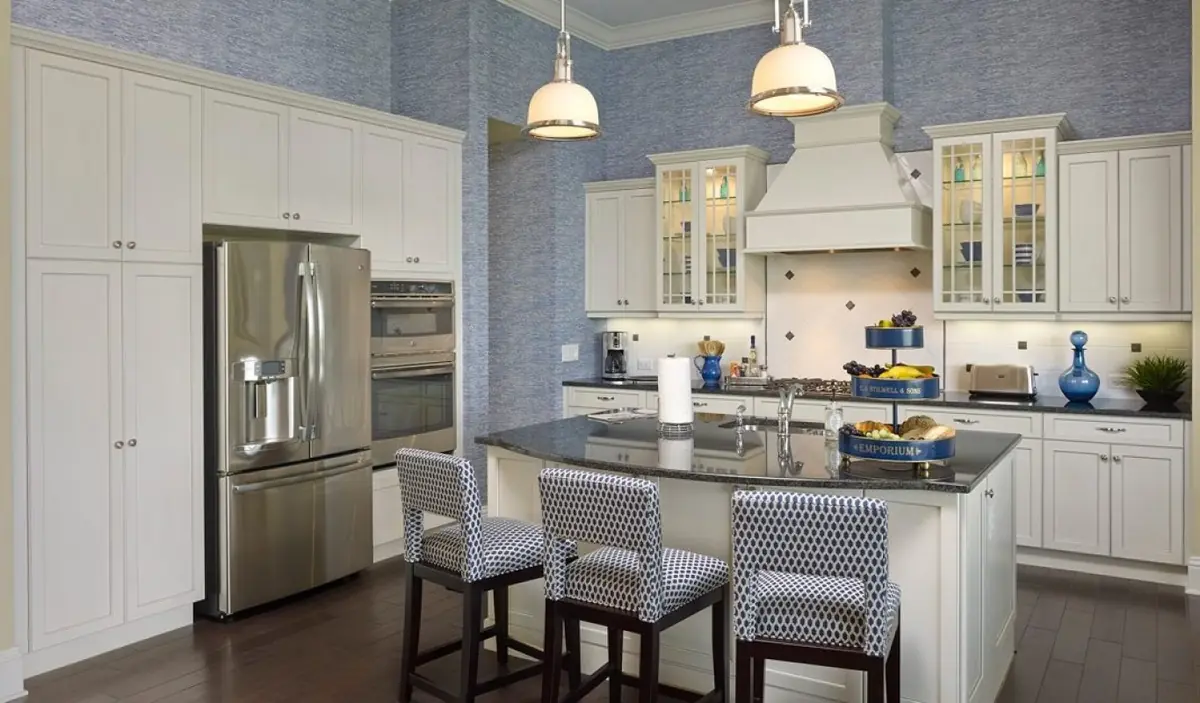 Chef’s kitchen with white cabinets and 9-lite offset mullion glass doors