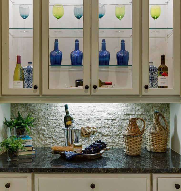 Custom Butler Pantry with clear glass doors and glass shelves