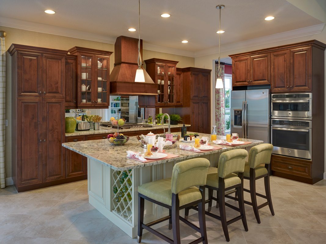 Two Tone Chef's Kitchen with custom Cabinets and Island with Custom Wine Rack